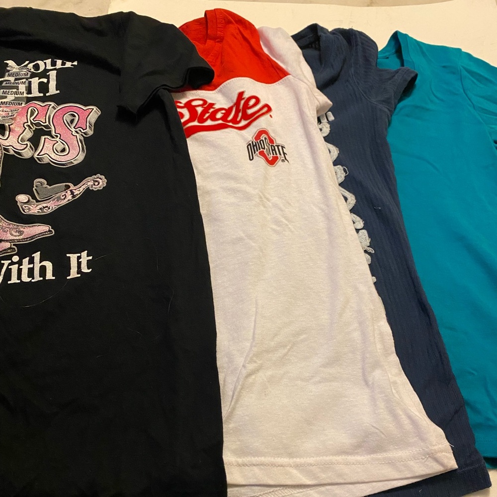 A bundle of four women tops size medium